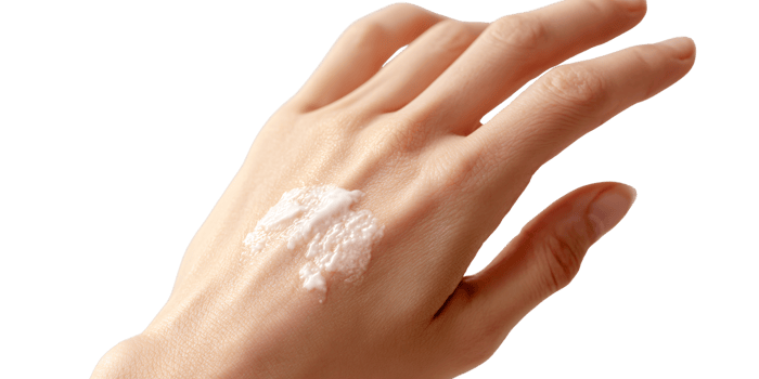 Womans hand applying moisturizing cream for skincare routine Concept of beauty, wellness, dermatology, and selfcare for healthy skin png