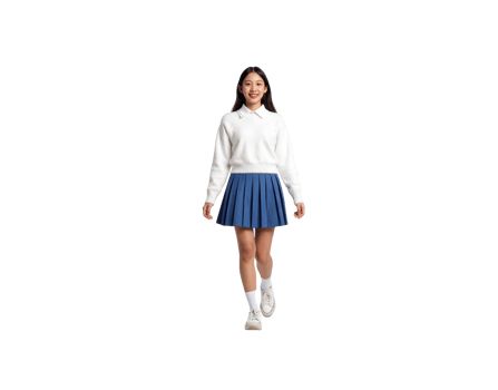 Happy Asian student in a white knit sweater and blue pleated skirt walking forward with a bright smile. png