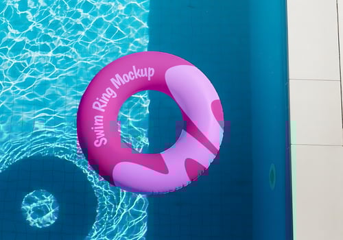 A pink swim ring mockup floats in a clear blue pool psd