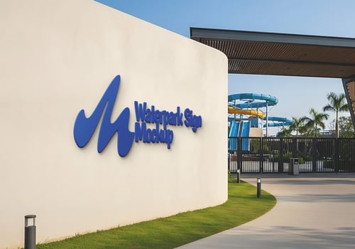 A waterpark sign mockup on a wall outside a gated entrance psd