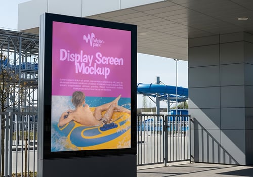 A water park display screen mockup showing a person enjoying a water ride psd