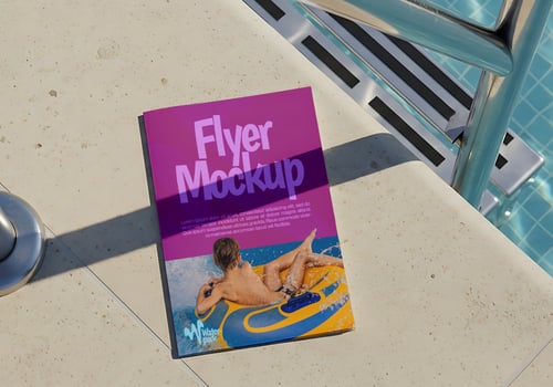 A purple flyer mockup rests by a pool showcasing a child enjoying a water park psd