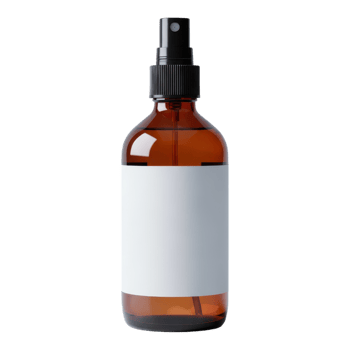 An amber glass spray bottle with a white label isolated on transparent background png