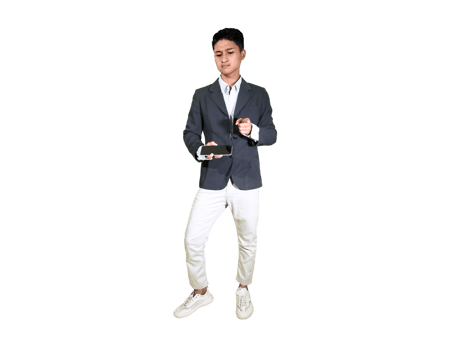 Young Male Standing with Phone in Hand and Focused Expression png