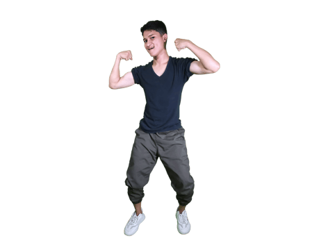 young man dressed casually poses happily sitting while showing off his arm muscles. png