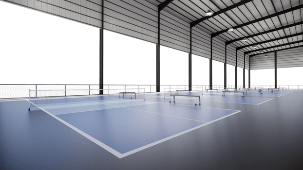 Corner view pickleball tennis courts inside metal structure building with transparent background png