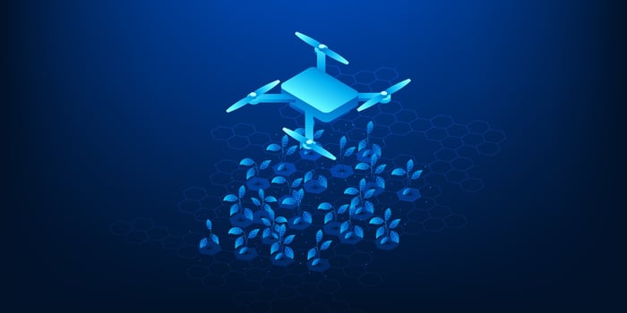 Drone planting seeds in a field vector