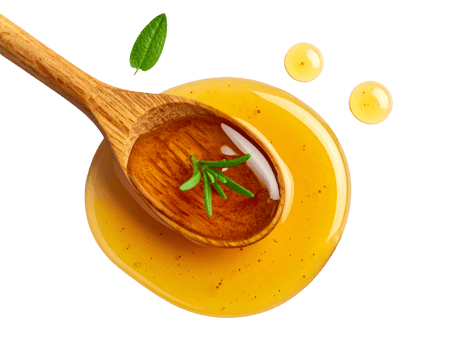Honey drops and wooden spoon with golden honey and fresh green herb leaves on isolated background png