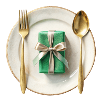A green gift wrapped in gold ribbon sits on a plate with gold forks and spoons png