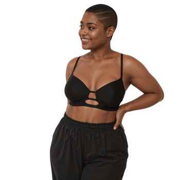 Confident woman with stylish haircut, sportswear and relaxed expression, standing proudly in studio png