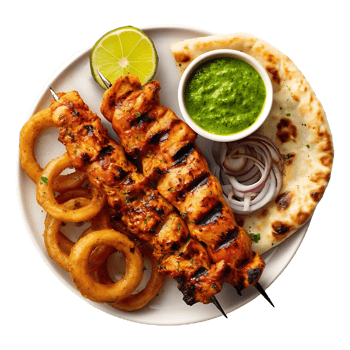Grilled chicken skewers onion rings naan and green sauce a delicious meal png