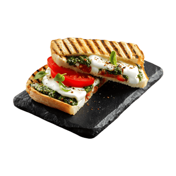 Grilled sandwich with mozzarella tomato pesto and basil on dark slate png