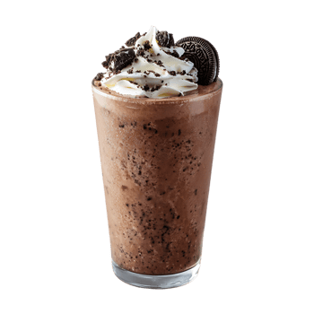 Chocolate milkshake with whipped cream and cookie crumbles a delicious cold treat png