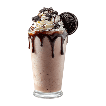 Delicious chocolate milkshake topped with whipped cream chocolate cookies and chocolate syrup png