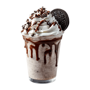 Delicious chocolate milkshake topped with whipped cream cookie crumbs and chocolate sauce png