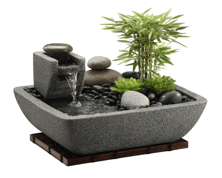 Small tabletop fountain featuring soothing water sounds, surrounded by smooth stones and vibrant greenery, creating tranquil atmosphere for relaxation and meditation png
