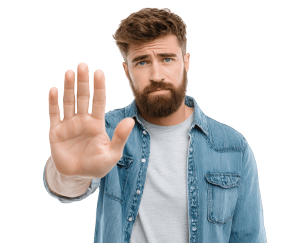 Man with beard is showing his hand in stop gesture, wearing denim jacket over light shirt. His expression conveys serious tone, suggesting need for attention or caution png
