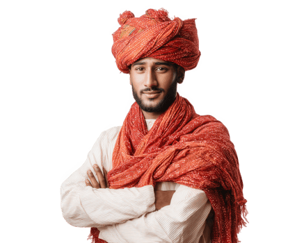 confident young man wearing vibrant red turban and shawl, showcasing traditional attire. His expression reflects pride and happiness, embodying cultural heritage and style png