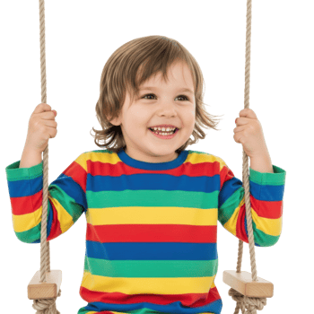 A cheerful toddler, dressed in a colorful striped shirt, laughs while enjoying a playful moment on a swing. png