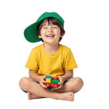 A joyful little boy wearing a green cap and yellow shirt sits cross legged, laughing happily while holding a colorful toy train. Ideal for childhood themes. png