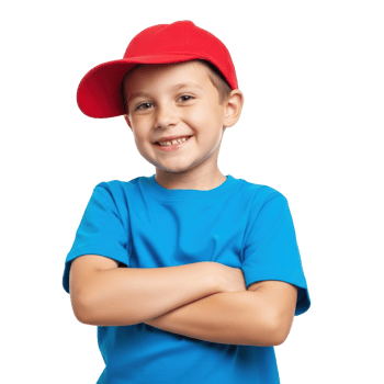 A happy young boy wearing a red baseball cap and blue t shirt smiles confidently with his arms crossed, looking directly at the camera. png