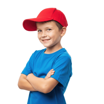A confident young boy in a red baseball cap and blue t shirt smiles with arms crossed, portraying happiness and readiness. png
