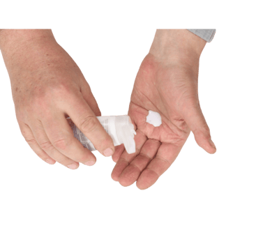 Man squeezing cream from a tube onto his hand on transparent background png