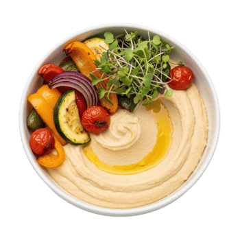 A vibrant bowl of creamy hummus topped with perfectly roasted bell peppers, zucchini, cherry tomatoes, red onion, and fresh microgreens, drizzled with olive oil. png