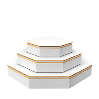 Elegant stack of three white octagonal boxes with gold trim png