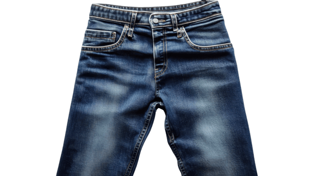 Blue denim jeans arranged flat emphasize their style and texture, showcasing a popular clothing choice for casual wear png