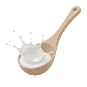 Wooden spoon cradling a splash of white liquid creating dynamic crown with isolated transparency png