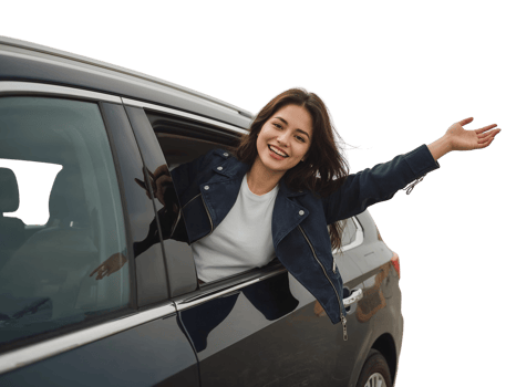 Euphoric young woman embracing the open road, leaning out of a car window in elation isolated png