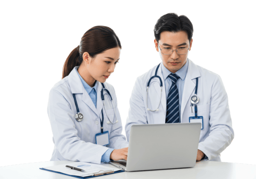 Asian male and female doctors collaborating on laptop in medical office. png