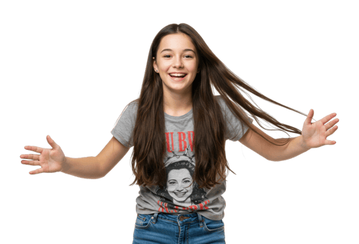 Smiling young female teen with long brown hair wearing graphic t shirt and blue jeans. png