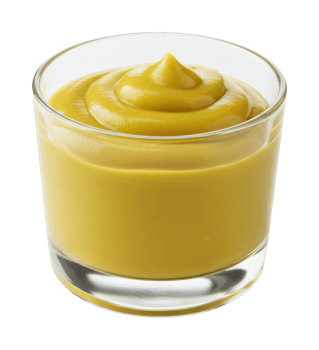 Fresh yellow mustard in glass cup against white for culinary use. png