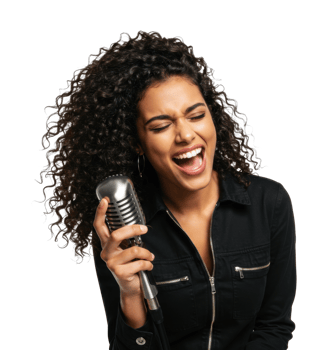 Energetic young african female singing with vintage microphone. png
