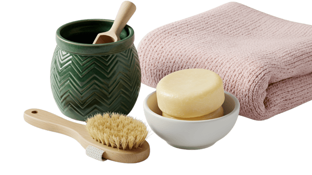 Natural Spa and Self-Care Essentials with Dry Brush, Solid Shampoo, and Pink Towel png