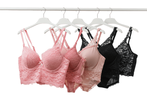 Elegant lace bras displayed in soft pastel colors retail store fashion indoor setting. png