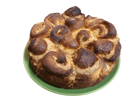 Delicious monkey bread resting on a green plate with a white background png