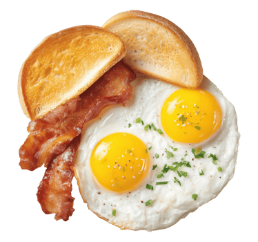 Traditional breakfast with fried eggs, crispy bacon strips and toasted bread isolated on transparent background png