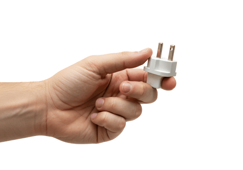Hand holding electrical plug against transparent background png