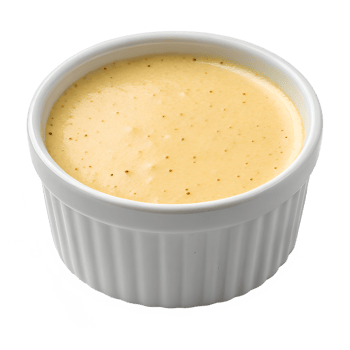 Classic vanilla bean custard with visible bean specks, baked in a white ramekin, silky texture png