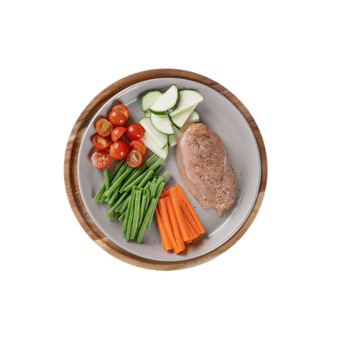 Overhead view of a healthy chicken and vegetable meal isolated on transparent background png