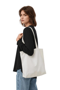 Stylish woman showcasing a reusable white canvas tote bag against a neutral setting for png
